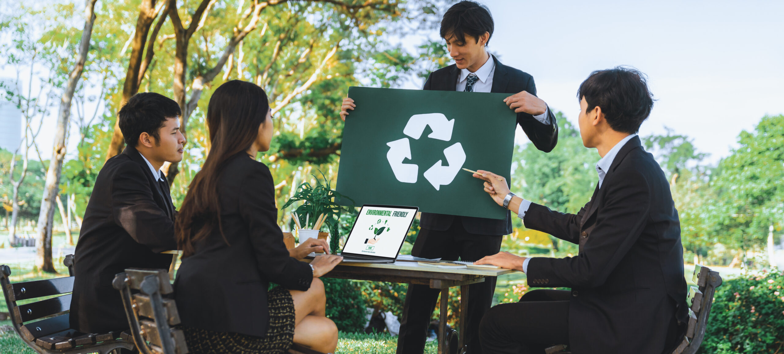 Group of businesspeople meeting at outdoor office with recycle. Gyre